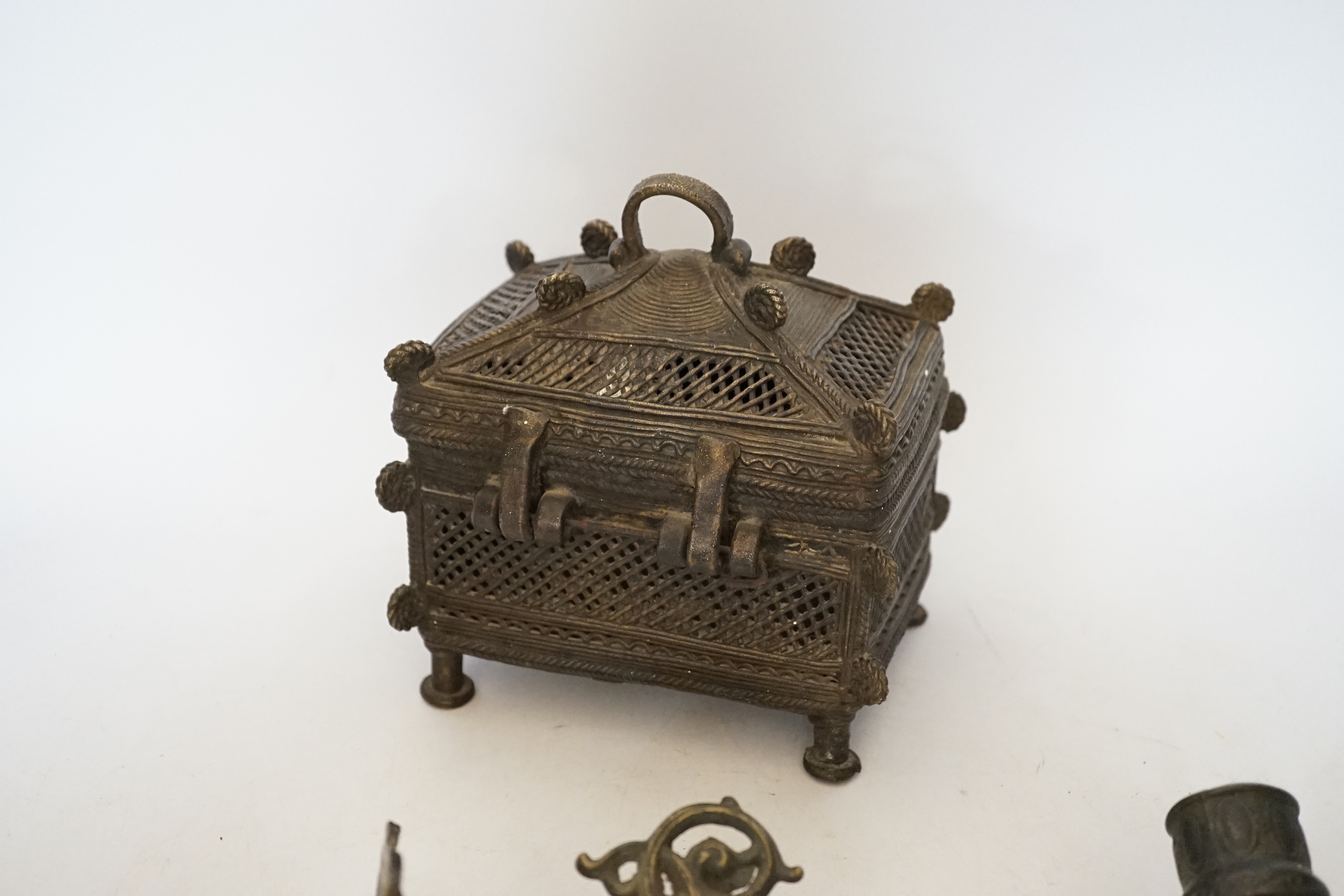 An African Benin style bronze casket and pair of wall sconces, 22cm